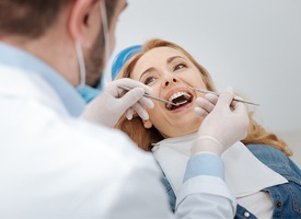 Older woman receiving dental exam