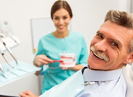 Smiling senior man in dental chair