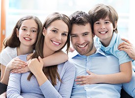 Happy smiling family of four