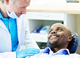 Smiling man in dental chair