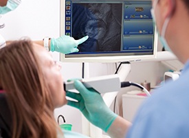 Dentist and patient looking at intraoral images